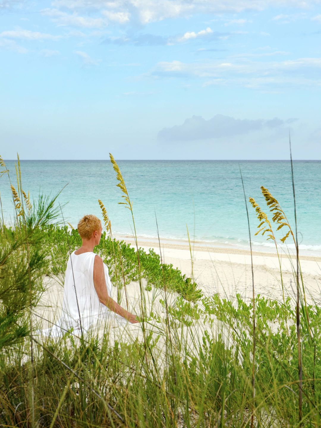 A Man Sitting On A Beach