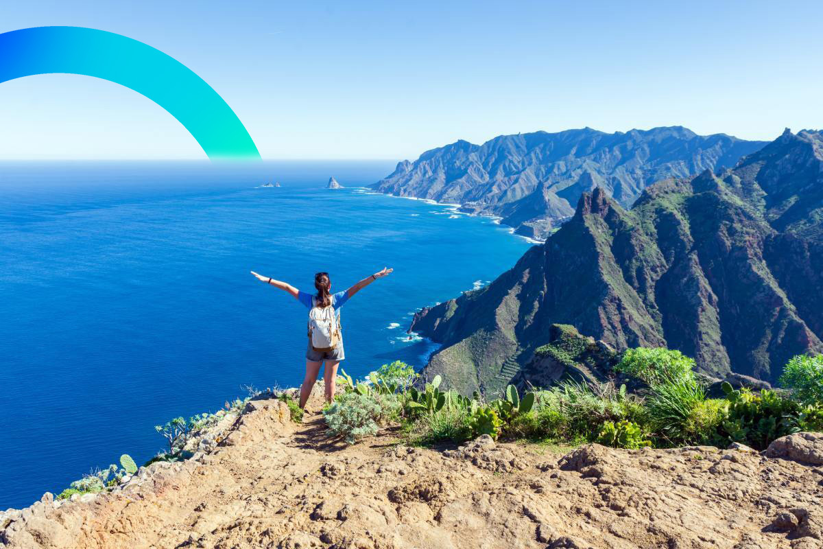 Woman hiker watching beautiful costal scenery. Tenerife, Canary Islands, Spain © iStock