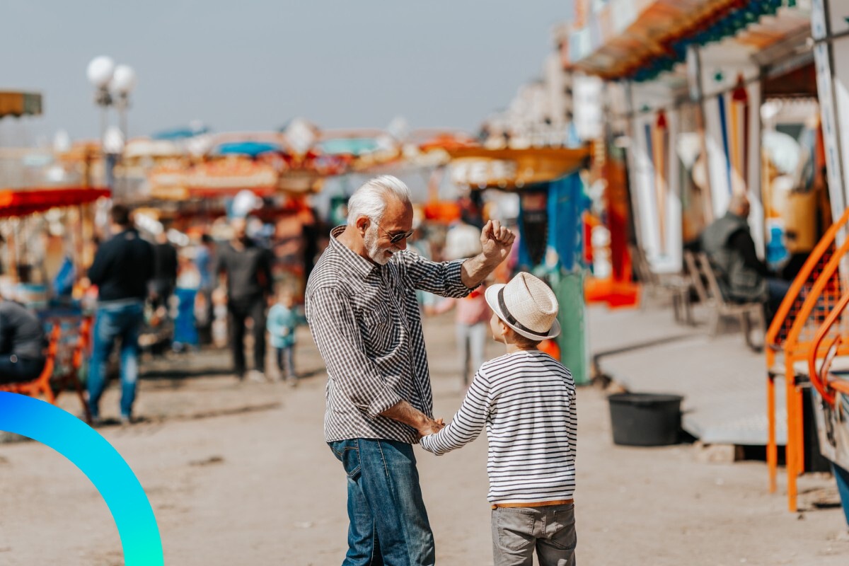 Grandpa with a grandson in an amusement park © shutterstock